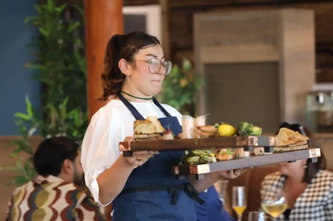 Waitress holding a tray